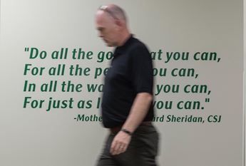 Jason Wesco walking in front of quote