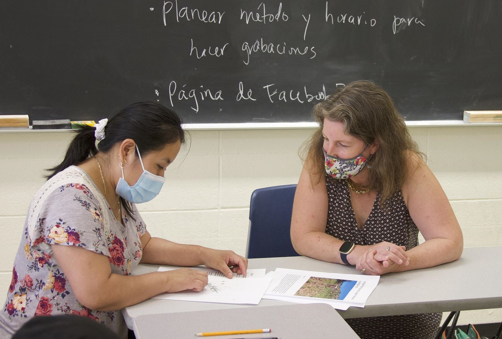 women working on a language preservation project