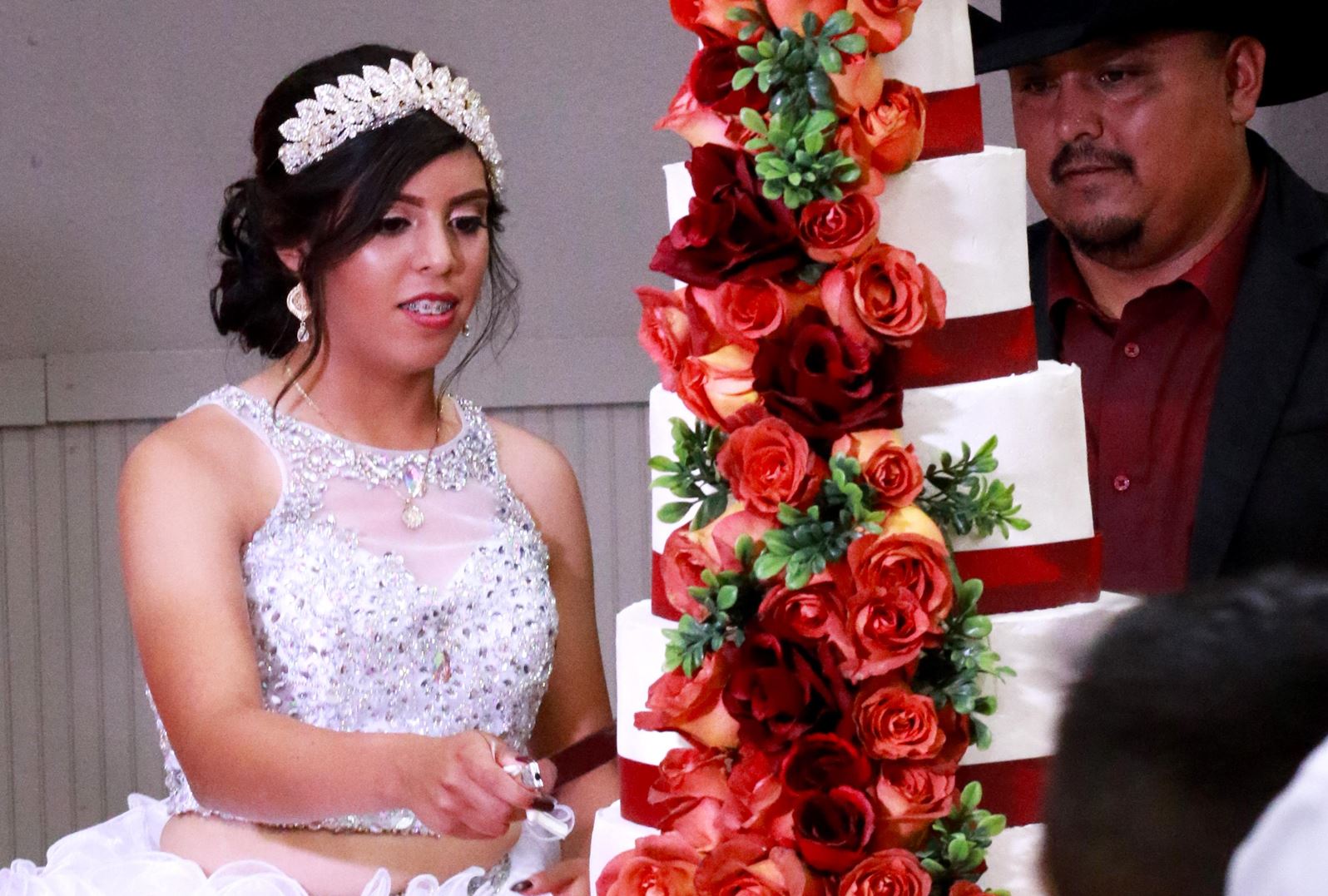 Cutting the cake at Quinceanera 