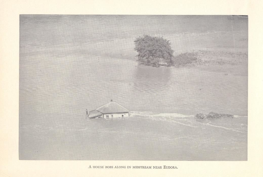 A house floats along in the 1951 flood near Eudora.