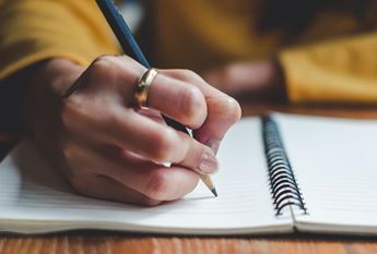 hand writing in notebook