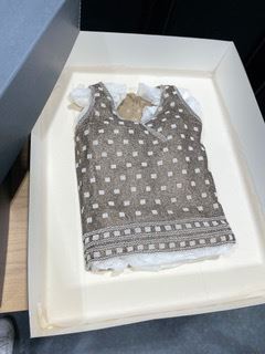 beaded top in an archival box