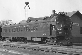 Motor car that was used to transport passengers, goods, and mail from Marysville through Onaga until 1955. Black and white.