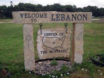 Stone sign reading "Welcome to Lebanon: Center of the 48 States"