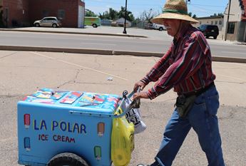 Paletero Francisco Solis pushes cart