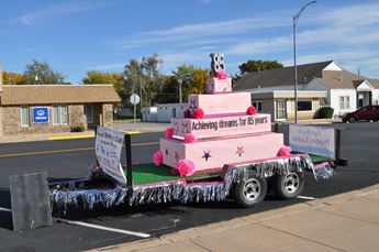 Pink parade float on a city street