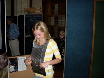 girl playing a washboard