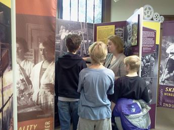 people taking tour in museum exhibition