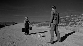 girl and man standing in a road