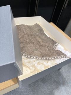 beaded skirt in an archival box