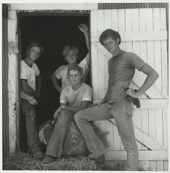 four boys on a farm