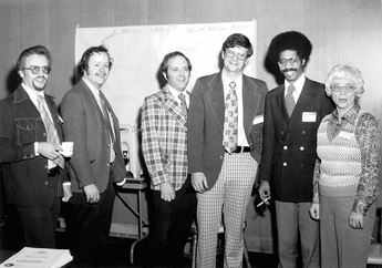 group photo of men and woman standing