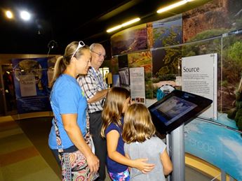 family in museum exhibit