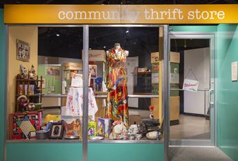 exhibition entrance that looks like a thrift store window