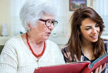 two women looking a photo album
