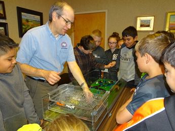 man demonstrating water activity for kids