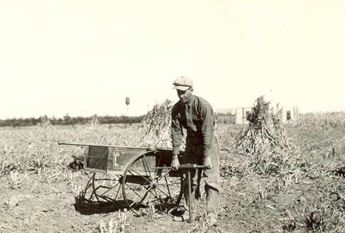 Joe Kuska digs a soil sample at the Colby Branch Station. 