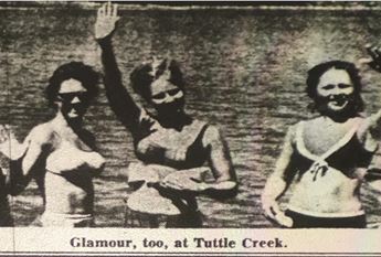 An image of three young women enjoying Tuttle Creek on April 9, 1967 in the Kansas City Star. This image entices tourists to vacation at the Tuttle Creek Reservoir, the construction of which erased many towns.