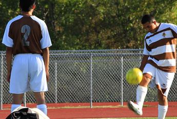 two men playing soccer