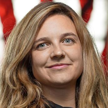 photo of woman in front of American flag background