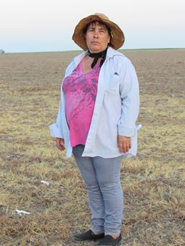 Woman stands in Kansas landscape