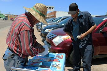 Customer buying mango paleta