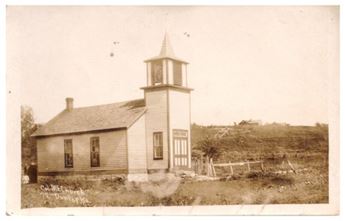 A photograph of the Colored Methodist Episcopal Church in Dunlap, Kansas, taken in 1933