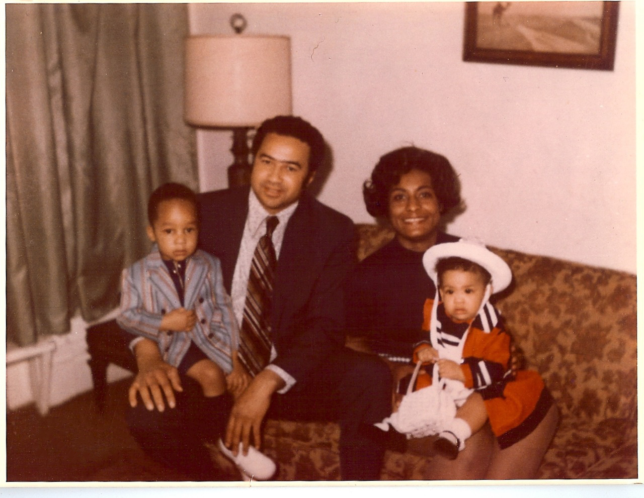 family sitting on couch