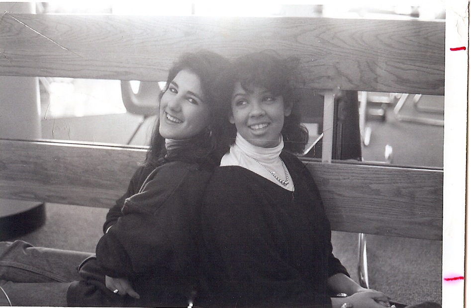 two girls sitting on a bench