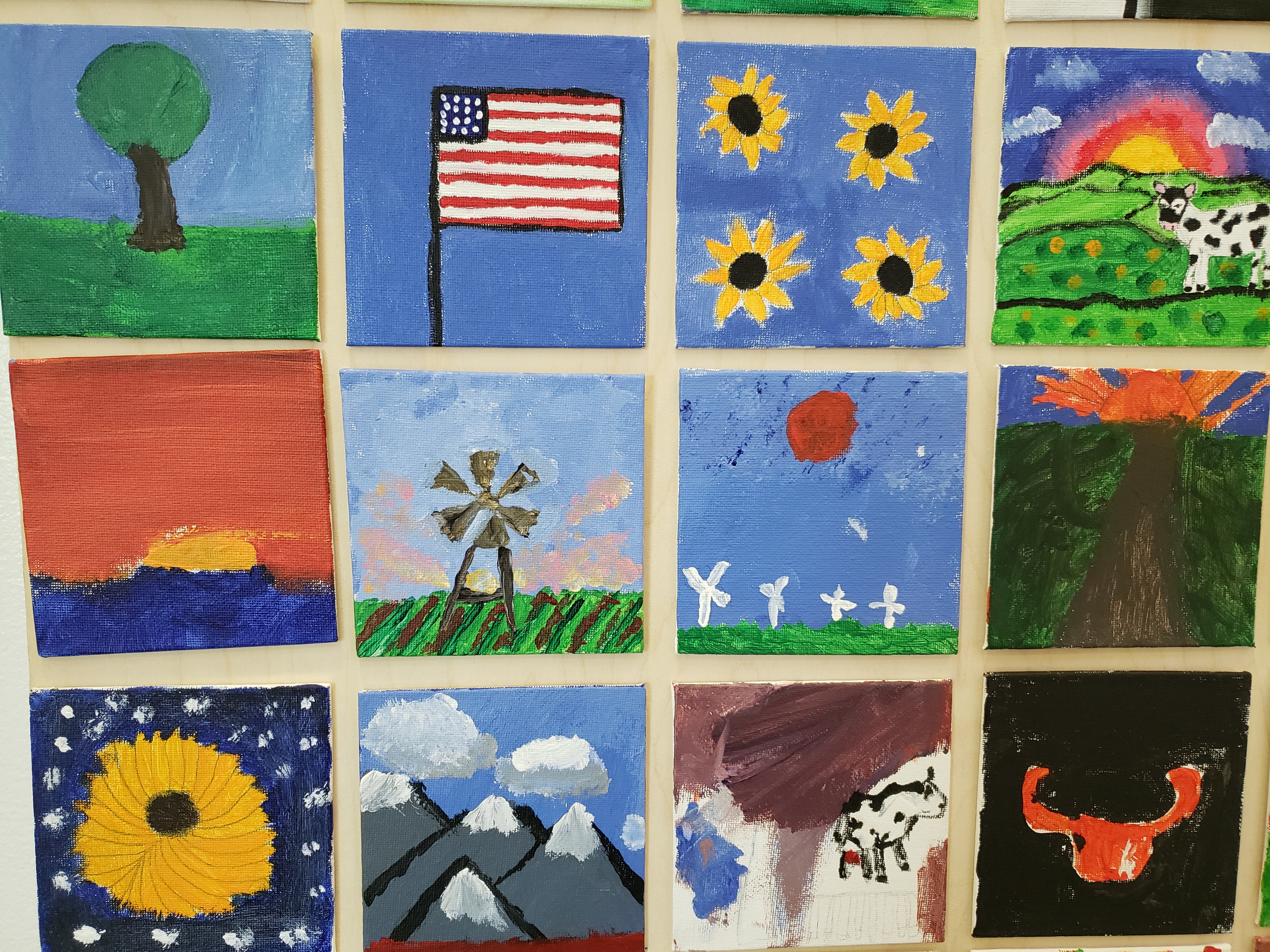 mini-canvases painted by Greensburg community members on the topic of "rural life"